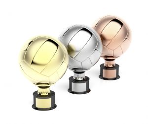 Gold, silver and bronze volleyball trophies on white background